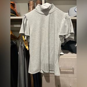 Rebecca Taylor gently worn mock turtleneck with rear zip, flutter sleeve detail